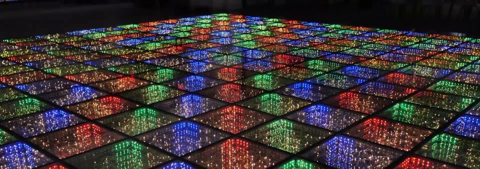 DNCE Group LED dance floor lit in rainbow colors